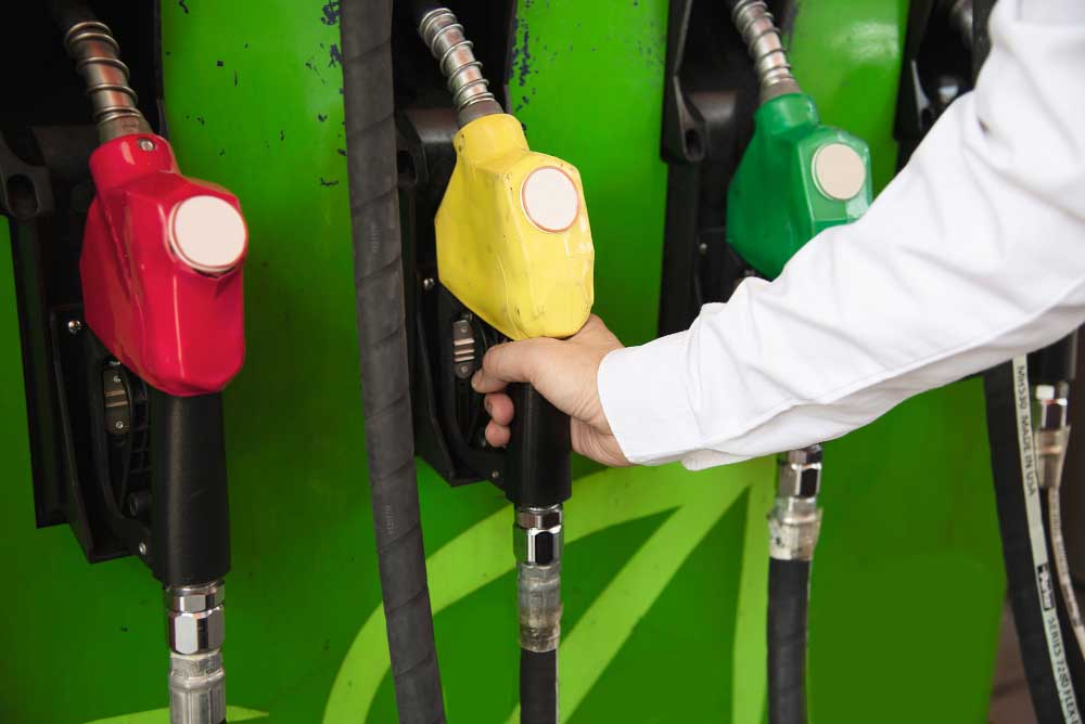 man-putting-gasoline-fuel-into-his-car-in-pump-gas-station